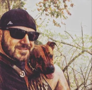Sonny Morgan with his service dog, Liberty